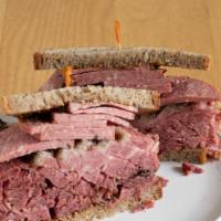 Skokie · Corned beef, coleslaw, swiss on rye with Russian dressing and your choice of side: potato sa...