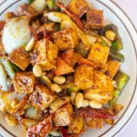 Kung Pao Tofu · Spicy. Fried tofu, green peppers, onion, peanuts, chili pods, house soy sauce