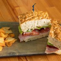 La Jolla Club · Turkey, ham, bacon, lettuce, tomatoes, onions, mustard, mayo, Gouda cheese on our famous foc...