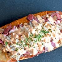 Reuben · Our House Bratwurst with Shaved Pastrami, Imported Swiss Cheese, Sauerkraut, Thousand Island.