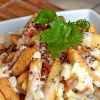 Elote Fries · Seasoned House Fries topped with Sweet Mexican Street Corn, Cilantro Aioli and green onion. ...