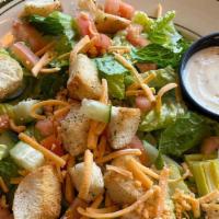 Garden Salad · BP Garden Salad is a crispy romaine lettuce topped with shredded cheddar cheese , tomato wed...