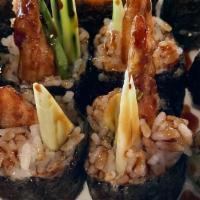 Shrimp Tempura Roll · Shrimp tempura, avocado, cucumber, mayo crunchy flakes topped with eel sauce.