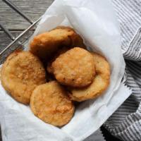 Fried Pickles · Crispy-fried, hand-breaded dill pickles with bbq ranch for dippin'.