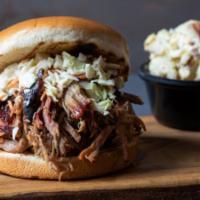 Pulled Pork Sandwich · Hickory-smoked and hand-pulled with a side of Mojo Mild sauce. Served with one Southern Side...