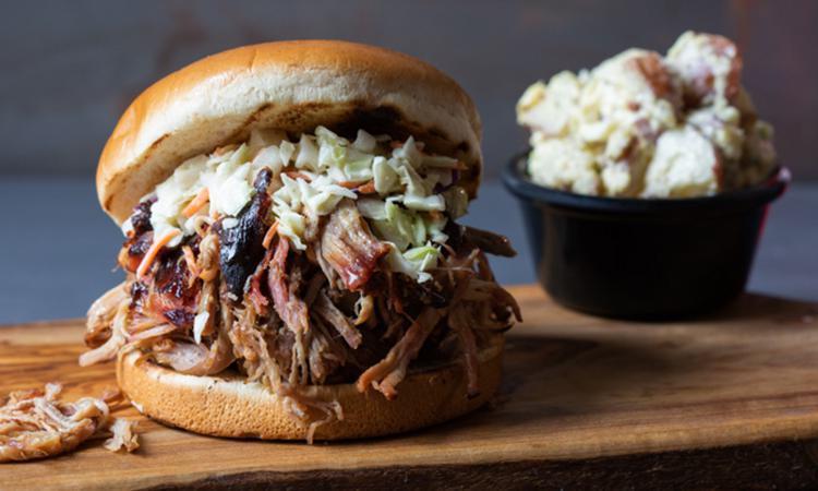Pulled Pork Sandwich · Hickory-smoked and hand-pulled with a side of Mojo Mild sauce. Served with one Southern Side.  Like your sandwich topped with Cole Slaw? ...ask for Memphis-style.