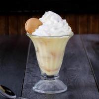 Banana Pudding · Rich vanilla pudding with bananas slices and vanilla wafers, topped with whipped cream and a...