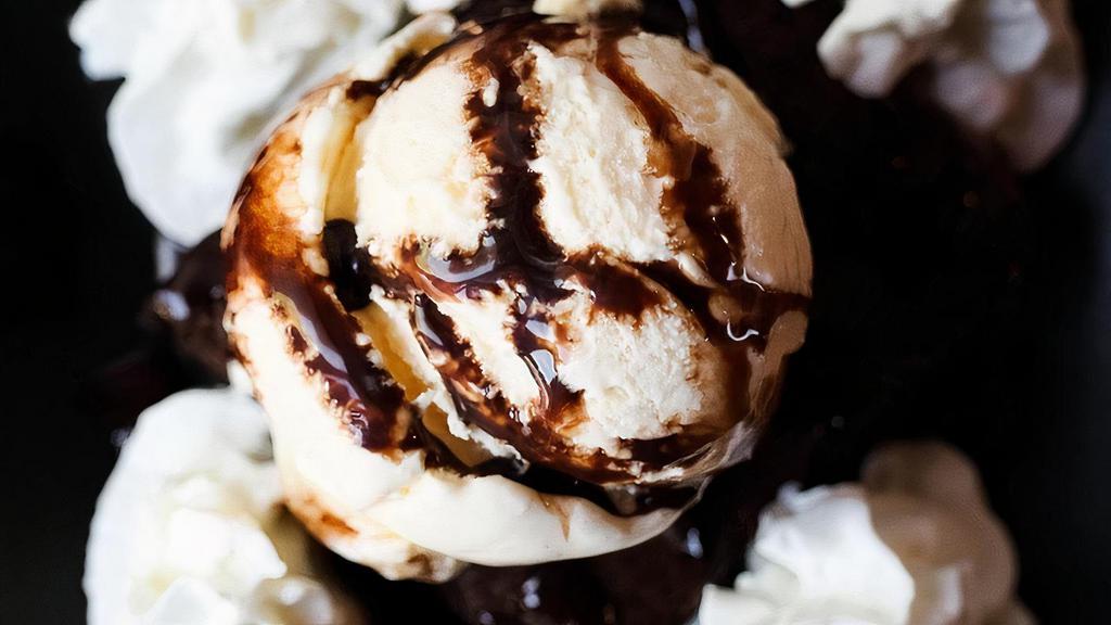 Brownie Sundae · Fresh-baked chocolate brownie, vanilla ice cream, chocolate sauce, whipped cream and a cherry.