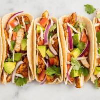 Chicken Taco · Folded tortilla with a variety of fillings such as meat or beans.