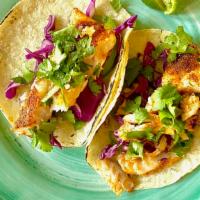 Fish Taco · Folded tortilla with a variety of fillings such as meat or beans.