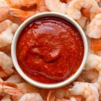 Steamed Shrimp · 10 pieces jumbo steamed shrimp on a bed of lettuce seasoned with old bay and served with coc...