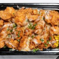 Bnb Bowl · Poblano Mashed Potatoes topped with pasilla gravy, corn, chicken nuggets, Oaxaca cheese and ...