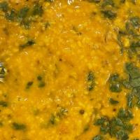 Yellow Dal Tadka (Vegan) · yellow split mung beans Sautéed in onions, cumin, and various  other spices.