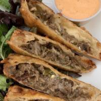 Philly Steak Eggrolls · Hand-rolled, shaved ribeye steak, American cheese, monterey jack, peppers, onions, chipotle ...