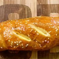Sausage & Cheddar Hand-Crafted Pretzel · Our golden artisan pretzel dough wraps and puffs around hard wood smoked sausage with pepper...