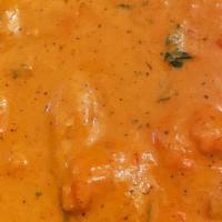 Butter Chicken · Boneless white meat chicken cooked with exquisite creamy tomatoes sauce.