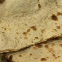 Plain Naan · Freshly baked white bread topped with butter.