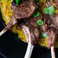 Lamb Chops · Fresh lamb chops marinated in chef's special sauce and barbecued in clay oven on a skewer.