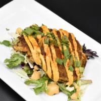 Crab Cakes · Lump crab meat, peppers & onions served over a mixed salad with citrus vinaigrette and remou...