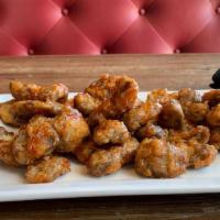 Gizzards · Battered and fried, tossed in a pepper jelly glaze.