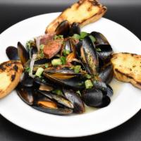 Mussels · White Wine, Roasted Garlic, Shallots, Andouille