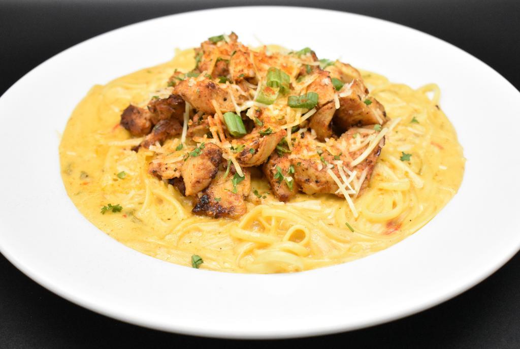 Kickin’ Chicken Pasta · Roasted jalapeño poblano cream sauce & blackened chicken. Add shrimp, crawfish, or chicken for an additional charge.