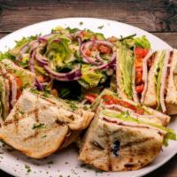 Turkey Club Sandwich · Triple decker on Sourdough.  Oven roasted turkey, bacon, lettuce, tomatoes, mayonnaise.
