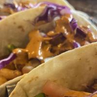 Shrimp Tacos · Three soft flour tortillas filled with lightly seasoned and gently fried shrimp, with red ca...