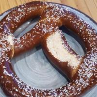 Pretzel With Dip · Large Bavarian style pretzel served with your choice of queso or raspberry melba sauce