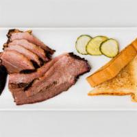 Sliced Brisket · Half pound of smoked, sliced brisket served with Texas Toast and pickles. Allergens: wheat, ...