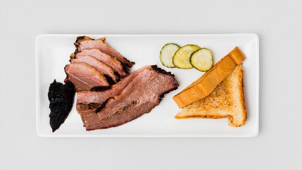 Sliced Brisket · Half pound of smoked, sliced brisket served with Texas Toast and pickles. Allergens: wheat, soy, egg