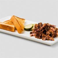 Chopped Brisket. · Half pound of smoked, chopped brisket served with Texas Toast and pickles. Allergens: wheat,...