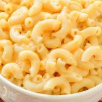 Macaroni & Cheese · Oven Baked Macaroni pasta tossed in a decadent and creamy cheese sauce.