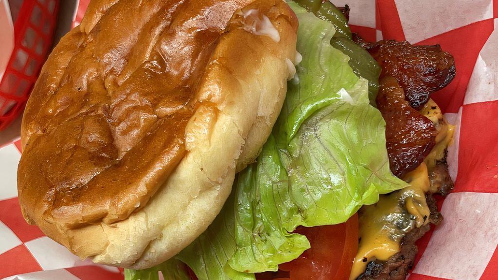 Cheeseburger Deluxe · 1/4 pound seasoned patty, with cheese, lettuce, tomato, onion, with your choice of mayo or miracle whip.