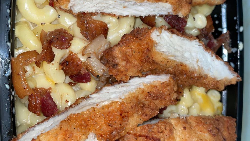 Shona'S Mac & Cheese · Four cheese mac and cheese topped with seasoned and fried chicken breast.