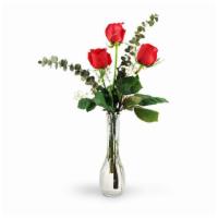 Three Red Roses · This simple yet classic arrangement, accented with fragrant eucalyptus and baby's breath, is...