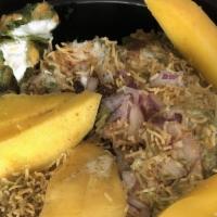 Aam Palak Chat · Crispy spinach, mango, tamarind sauce.