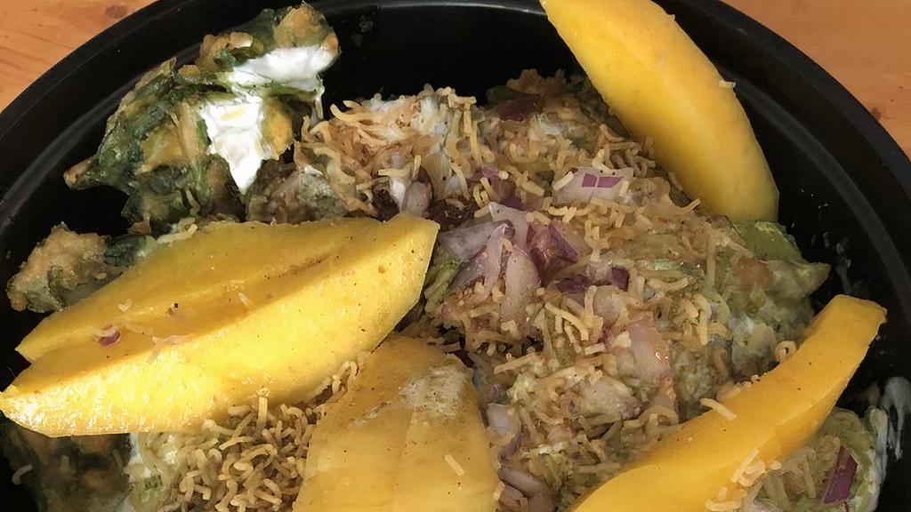 Aam Palak Chat · Crispy spinach, mango, tamarind sauce.