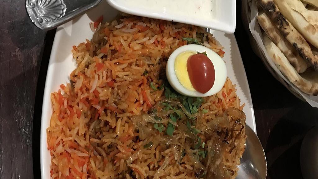 Chicken Biryani · Chicken, basmati rice, mild spices.