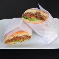 Steak And Cheese · grilled ribeye steak, onions, provolone cheese, lettuce, tomatoes, hot peppers, mayo on the ...