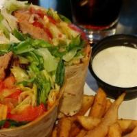 Ranchers Steak Wrap · Marinated skirt steak, roasted red peppers, grilled onions, lettuce and tomatoes. Served wit...