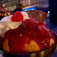 Fried Ice Cream · Strawberry or vanilla ice cream done in a special way.