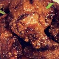 Boneless Wings · Tossed in your choice of sauce and served with celery and carrots with choice of ranch or bl...