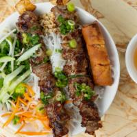 Grilled Pork & Egg Roll · Serve with pickled vegetables, bean sprouts, fish sauce, chopped: lettuce, mint, & cilantro ...