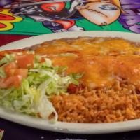 Burrito Plate · Chile con carne burrito smothered. served with your choice of red or green chile refried bea...