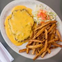 Hamburger Steak · Served with French fries and salad.