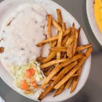 Chicken Fried Steak · Served with French fries and salad.