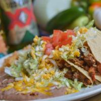 Taco Combo · Two delicious soft or hard shell tacos with your choice of ground beef, machaca (shredded be...