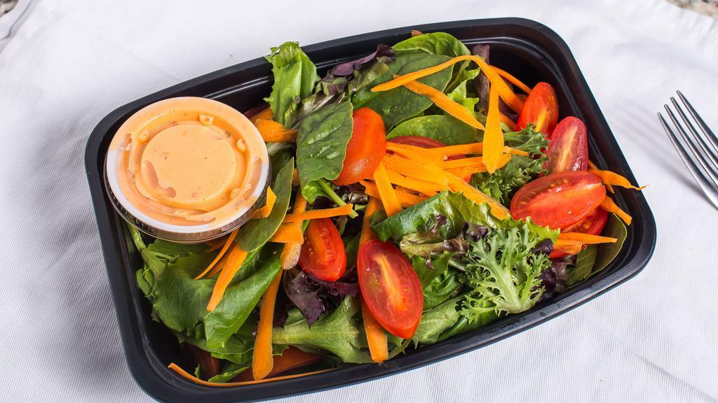 House Salad · Mixed greens with cherry tomatoes, carrots, and choice of Italian or ranch dressing.