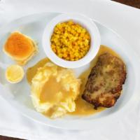 Tuesday · Tender roasted breaded chicken breast with mashed potatoes and gravy with corn.